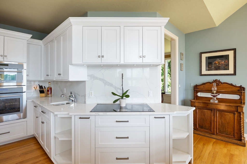 163 Little Harbor Road, Unit 163 New Castle, NH 03854 - Photo 20 of 36 a kitchen with stainless steel appliances white cabinets sink and a stove
