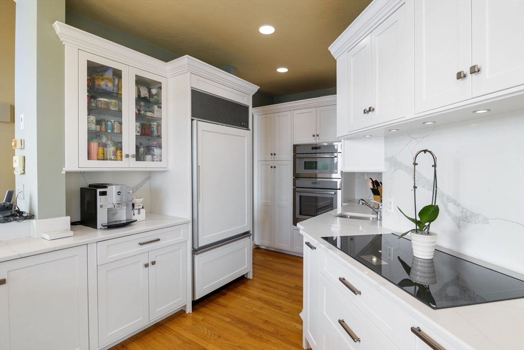 163 Little Harbor Road, Unit 163 New Castle, NH 03854 - Photo 21 of 36 a kitchen with granite countertop a sink stainless steel appliances and cabinets