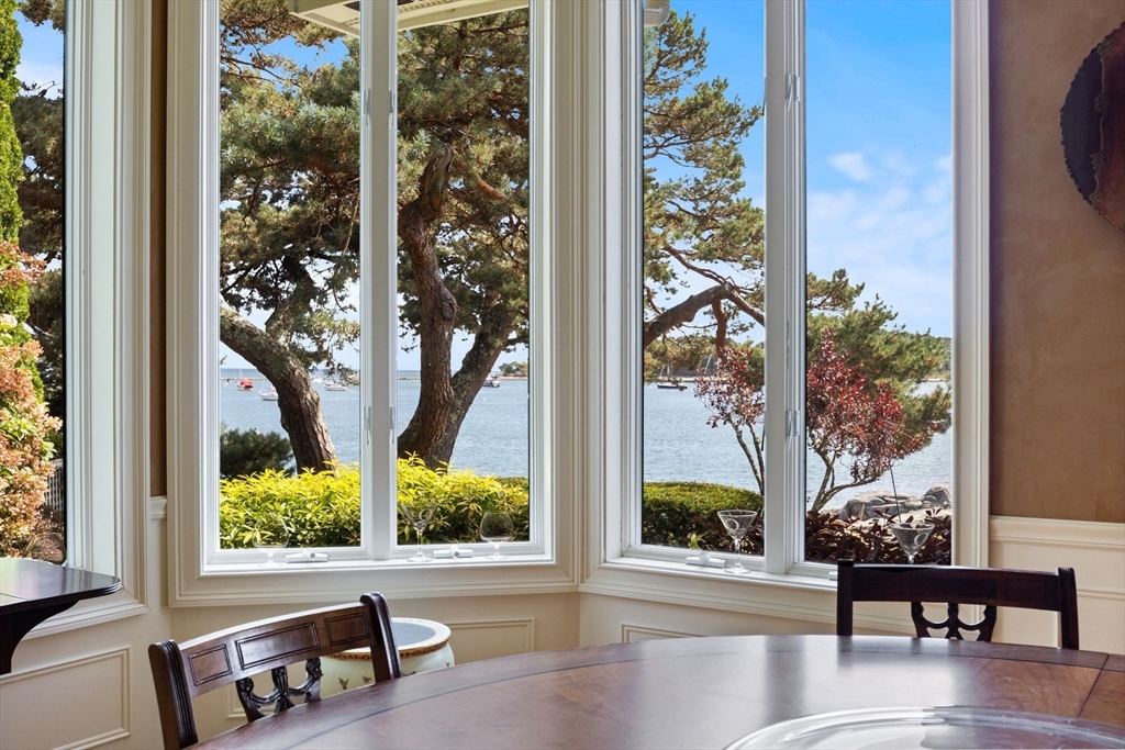 163 Little Harbor Road, Unit 163 New Castle, NH 03854 - Photo 22 of 36 a view of a porch with chairs and potted plants