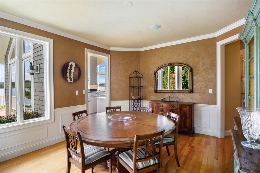 163 Little Harbor Road, Unit 163 New Castle, NH 03854 - Photo 23 of 36 a view of a dining room with furniture and window