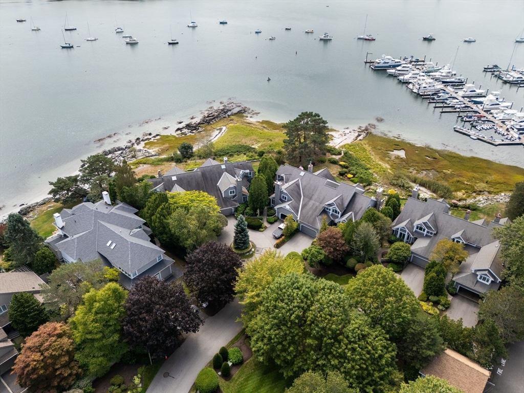 163 Little Harbor Road, Unit 163 New Castle, NH 03854 - Photo 3 of 36 an aerial view of lake residential houses with outdoor space