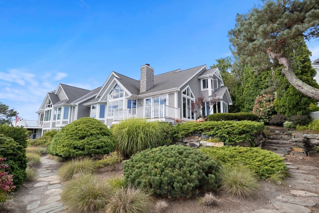 163 Little Harbor Road, Unit 163 New Castle, NH 03854 - Photo 32 of 36 a front view of a house with a yard