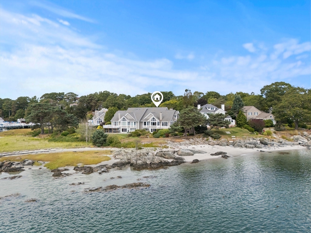 163 Little Harbor Road, Unit 163 New Castle, NH 03854 - Photo 34 of 36 a view of a lake with beach and large trees