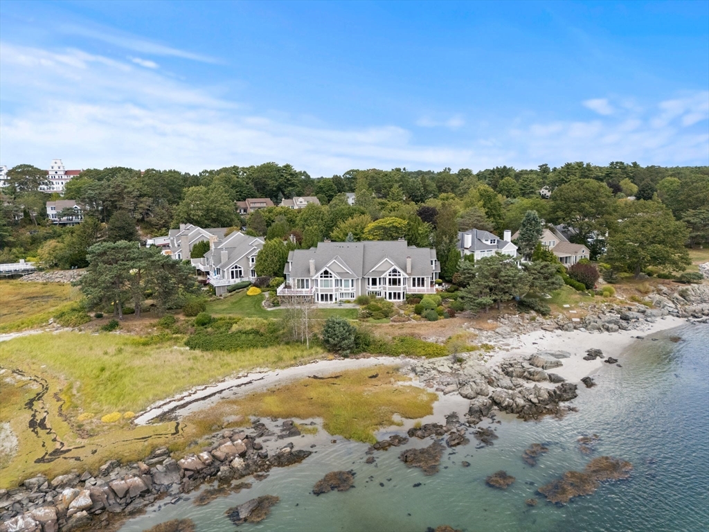 163 Little Harbor Road, Unit 163 New Castle, NH 03854 - Photo 35 of 36 a view of a town with mountains in the background