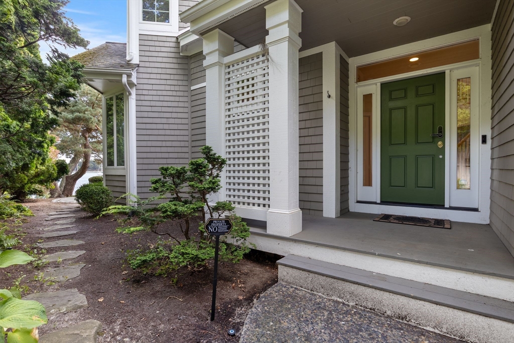 163 Little Harbor Road, Unit 163 New Castle, NH 03854 - Photo 4 of 36 a house with a garden and entertaining space