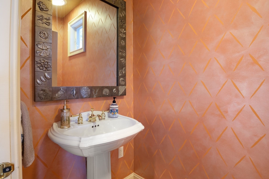 163 Little Harbor Road, Unit 163 New Castle, NH 03854 - Photo 10 of 36 a bathroom with a sink and a mirror