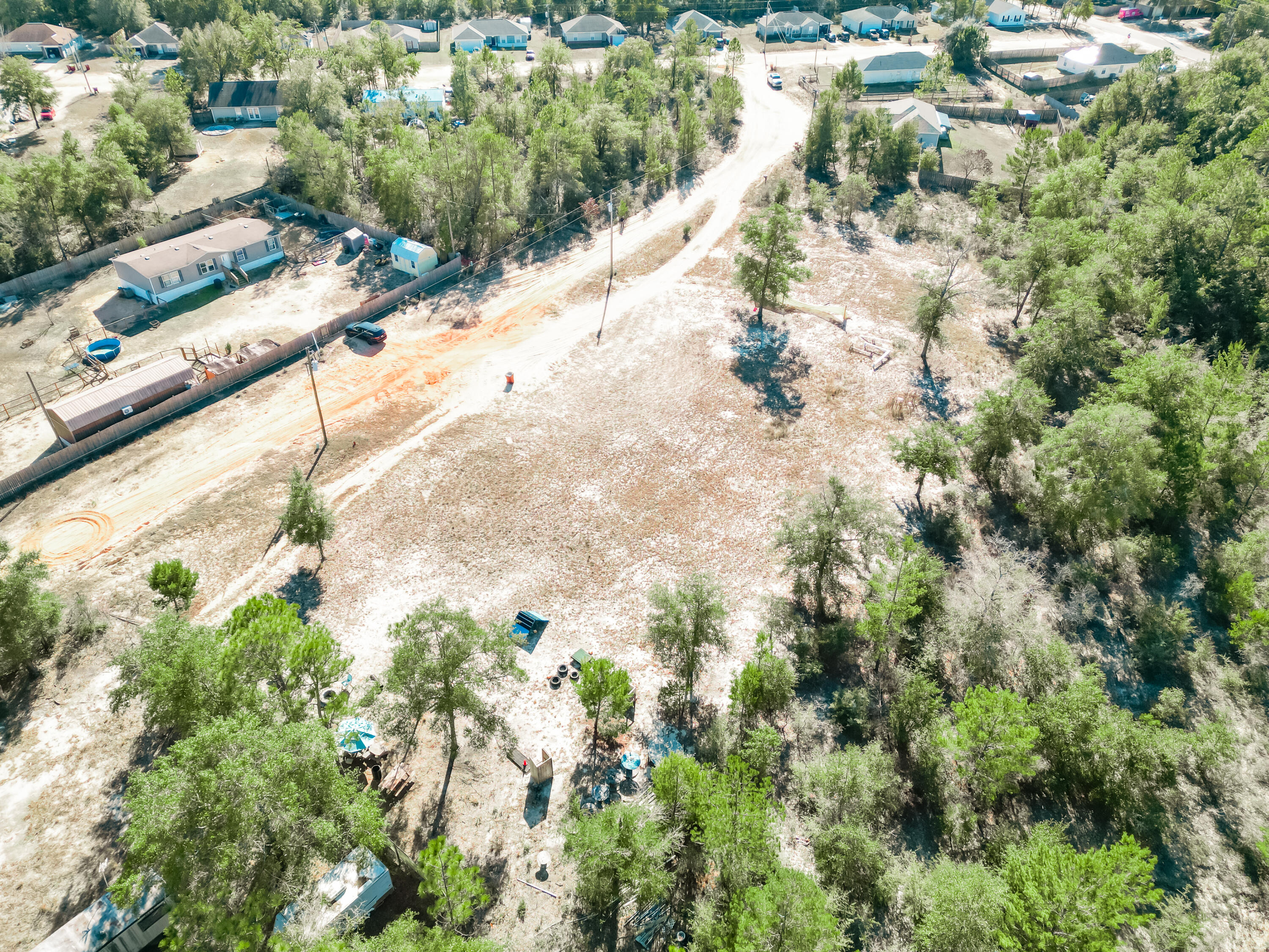 4716 Canary Way Crestview, FL 32539 - Photo 12 of 13 a view of a yard with a tree