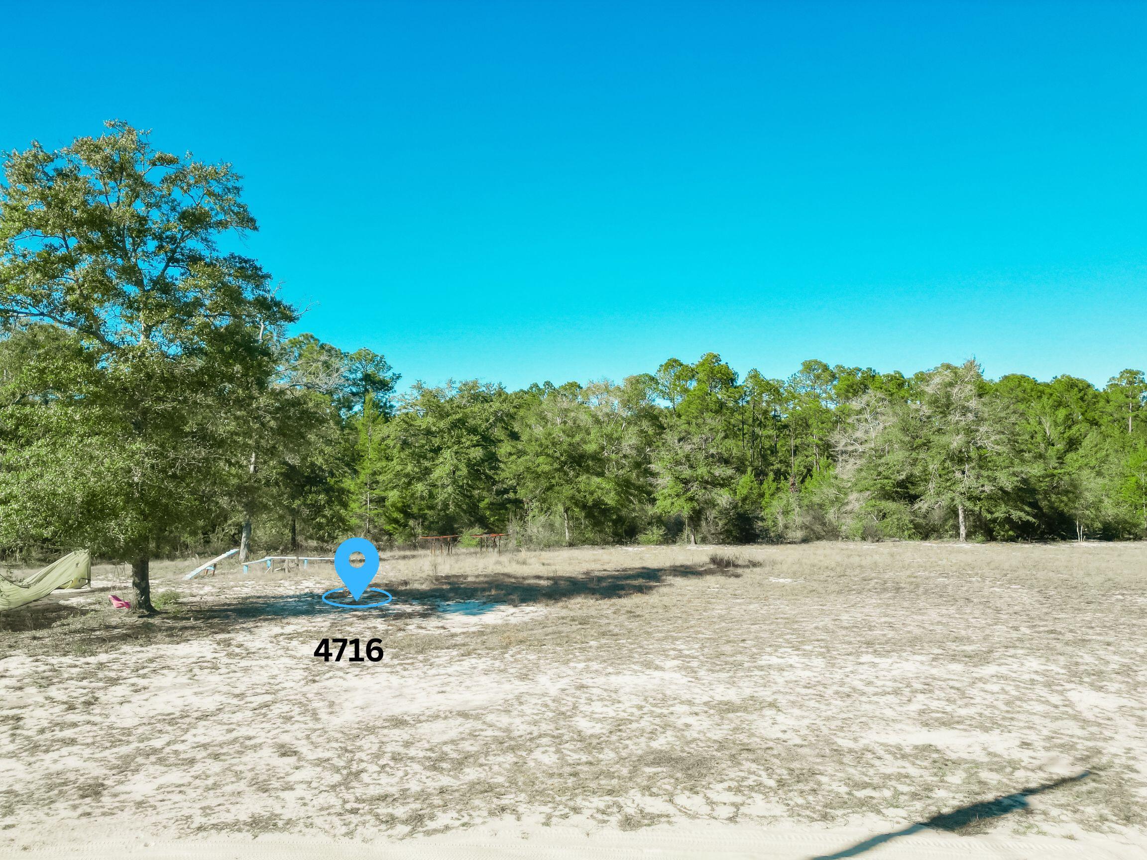 4716 Canary Way Crestview, FL 32539 - Photo 2 of 13 a view of a park with large trees