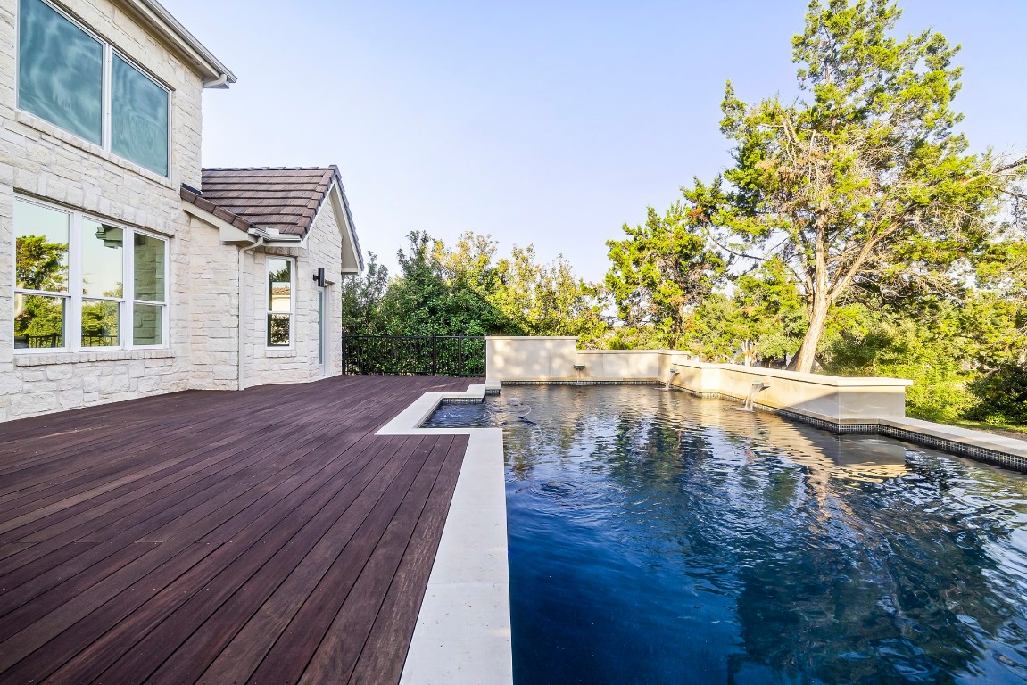 1 Sparrowglen Lane The Hills, TX 78738 - Photo 1 of 1 a view of a patio with wooden floor and a yard