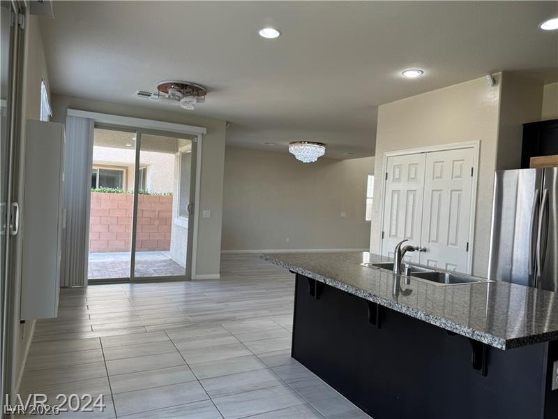 9056 Tony Ridge Avenue Las Vegas, NV 89148 - Photo 7 of 32 A well-lit interior offers a spacious layout, perfect for daily living and entertaining.