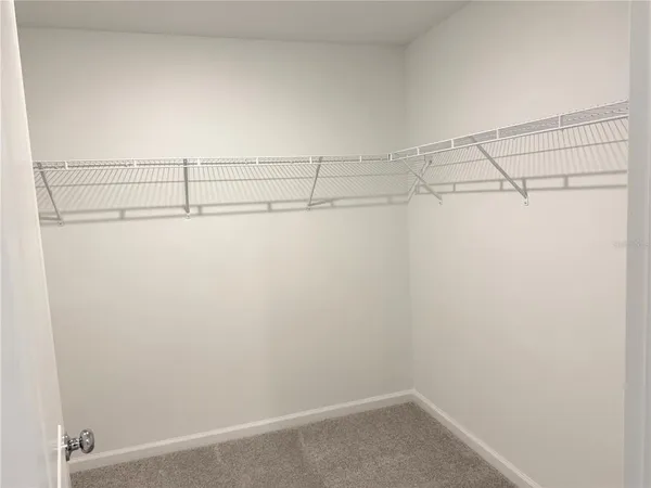 a view of a room with racks on the wall