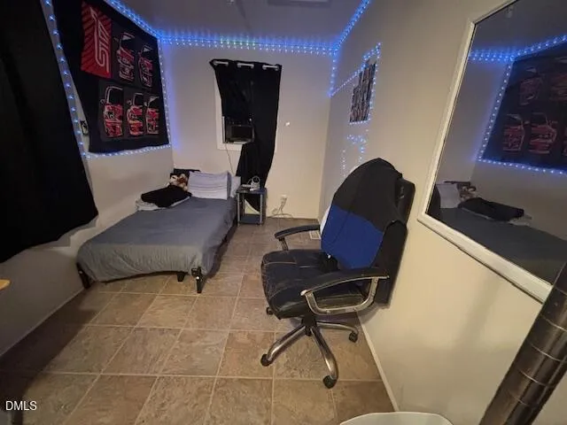 a living room with furniture and a chair