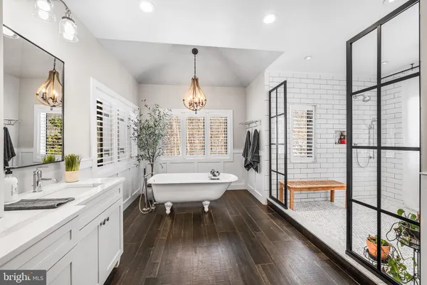 a bathroom with a tub and shower