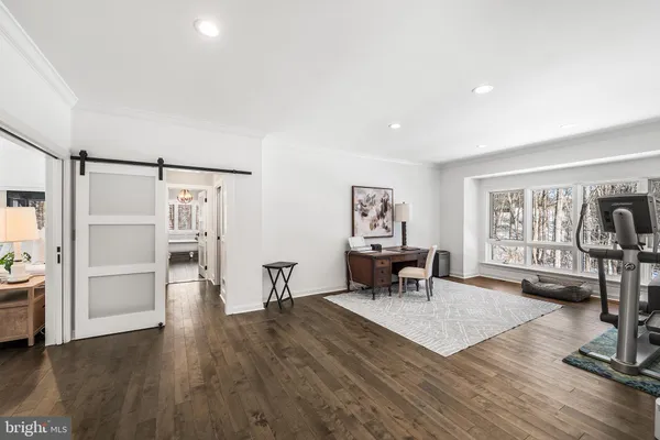 a large kitchen with stainless steel appliances kitchen island granite countertop a stove a sink a refrigerator and a wooden cabinets