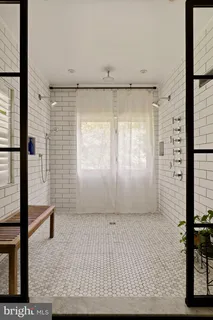 a living room with furniture wooden floor and a window