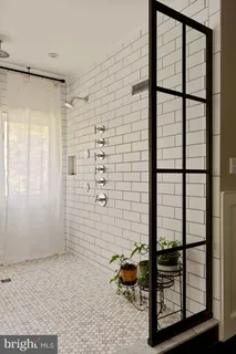 a kitchen with a sink cabinets and window