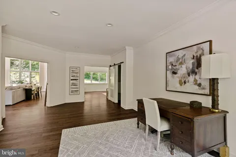 a living room with furniture a dining table and kitchen view