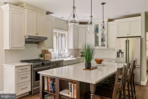 a kitchen with a sink cabinets and window