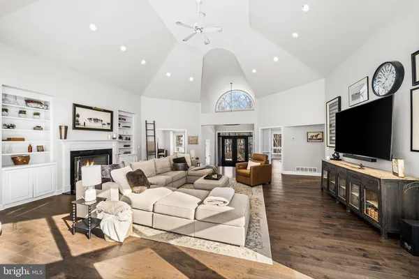 a living room with fireplace furniture and a flat screen tv