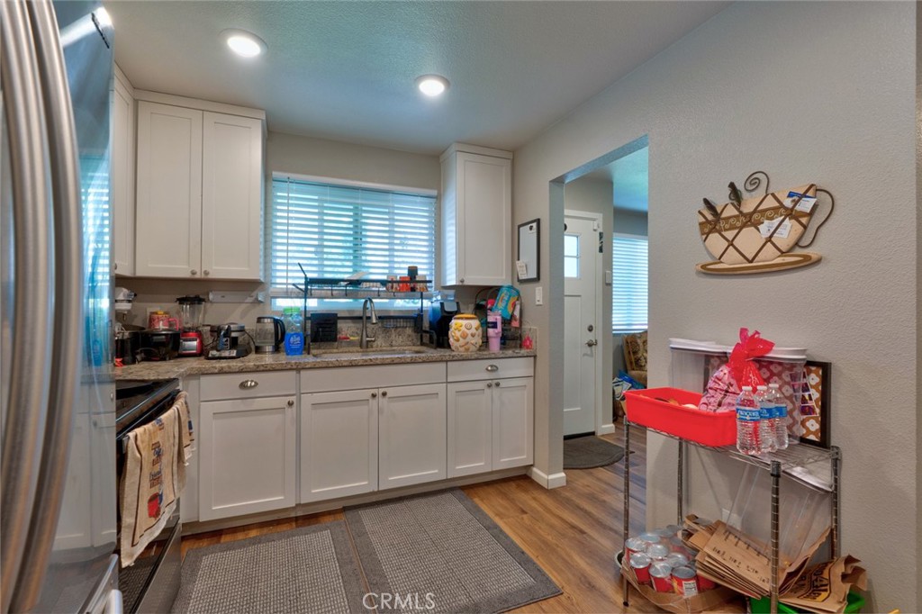 1840 Cheyenne Drive Merced, CA 95348 - Photo 21 of 90 a kitchen with a refrigerator and window
