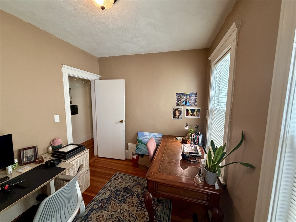 5 Partridge Avenue Somerville, MA 02145 - Photo 10 of 11 a work room with furniture and wooden floor