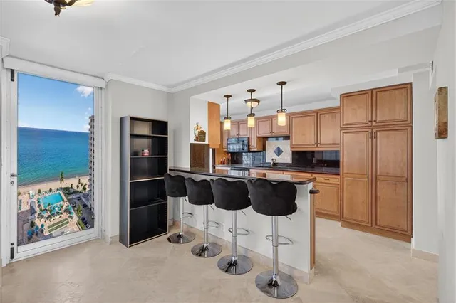 a kitchen with stainless steel appliances granite countertop a sink and cabinets