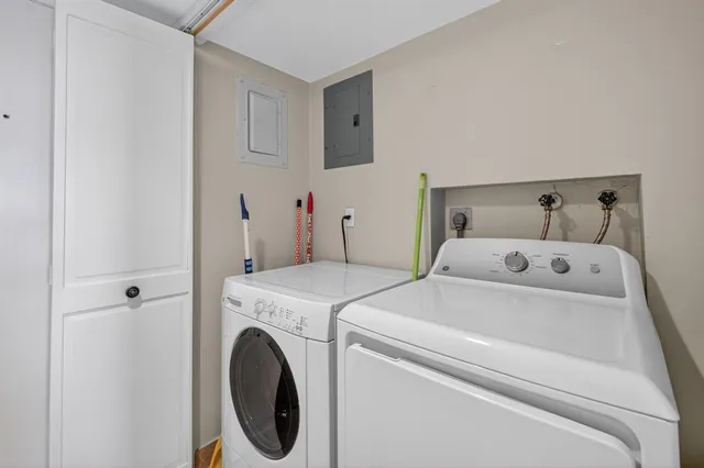 a bedroom with a large bed and a large window