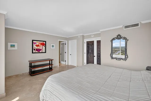 a spacious bathroom with a granite countertop sink mirror and shower