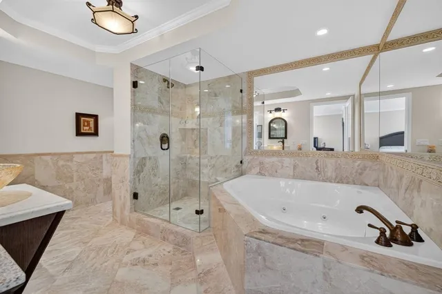 a bathroom with a tub and shower