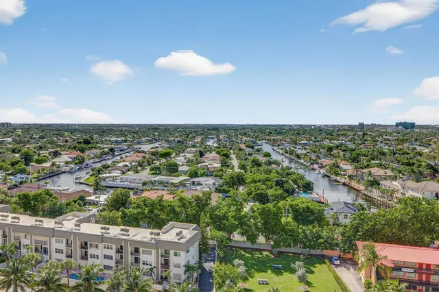 a view of a patio with dining table and chairs with plants