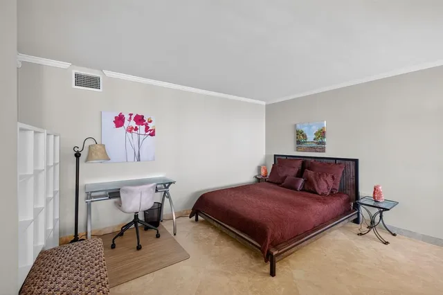 a kitchen with stainless steel appliances kitchen island granite countertop a refrigerator and a stove top oven