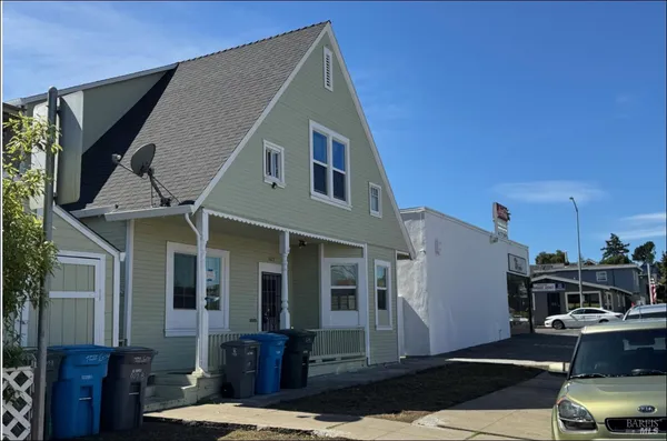a front view of a house with parking