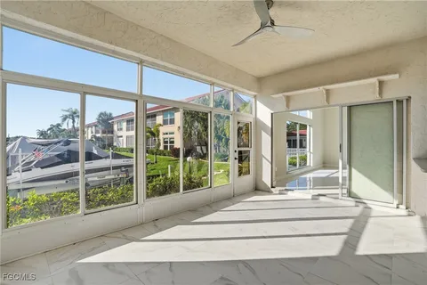 a view of a livingroom with an empty space & wooden floor