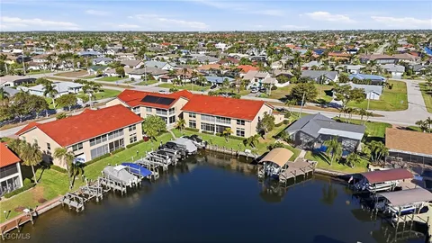 a couple of potted plants in front of door