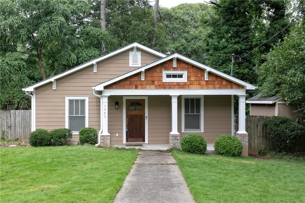 1297 Fenway Circle Decatur, GA 30030 - Photo 1 of 1 a front view of a house with a yard