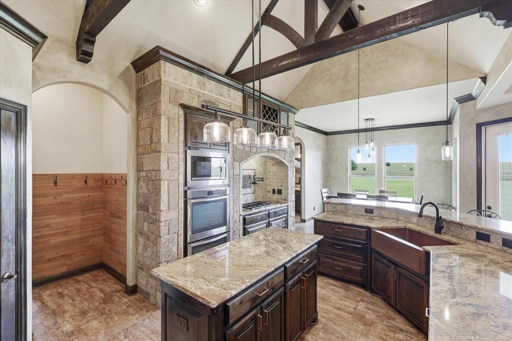 160 Vista Ridge North Decatur, TX 76234 - Photo 15 of 40 a kitchen with stainless steel appliances granite countertop a sink a stove and refrigerator