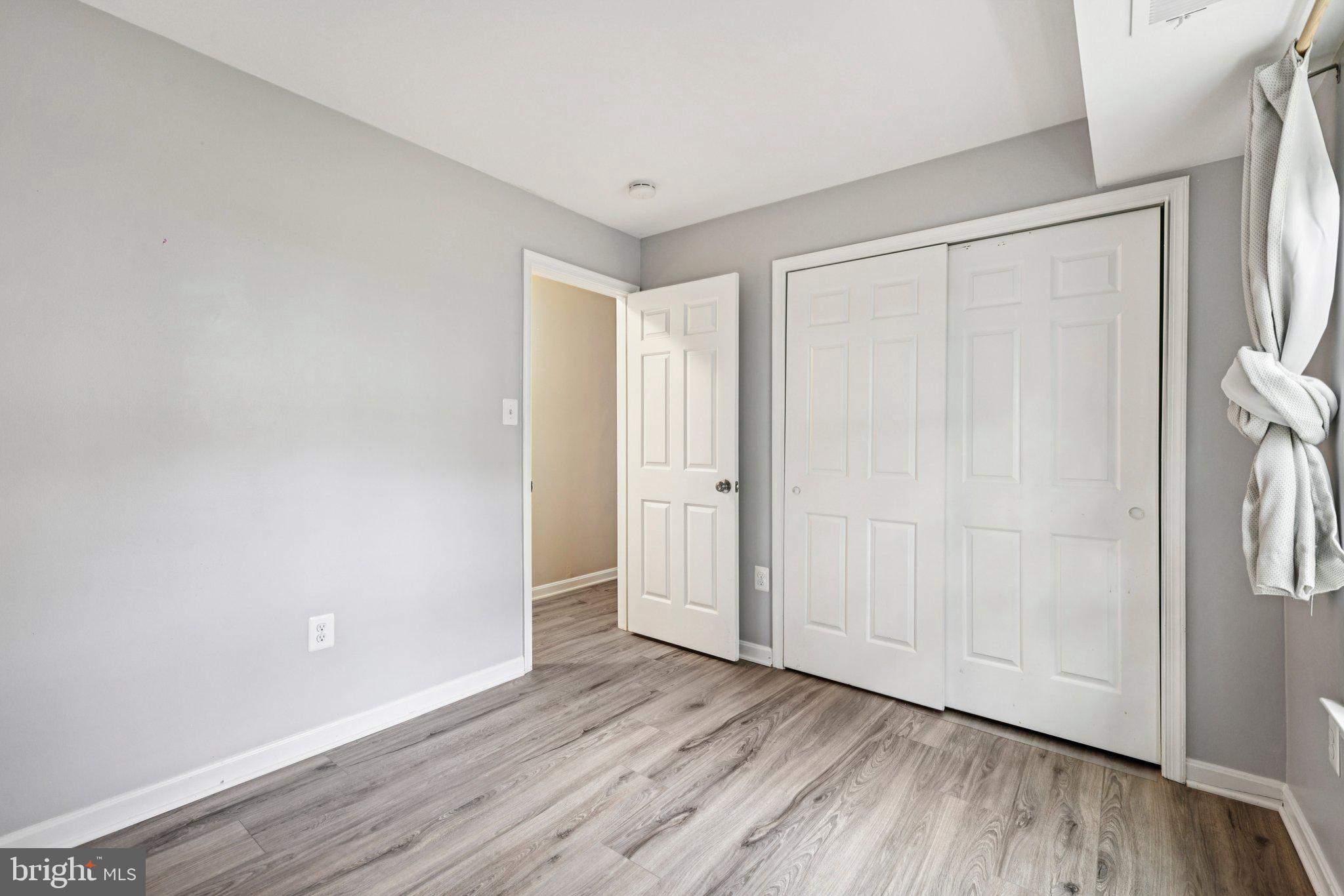 5707 Olde Mill Court, Unit 111 Alexandria, VA 22309 - Photo 15 of 32 a view of an empty room and wooden floor
