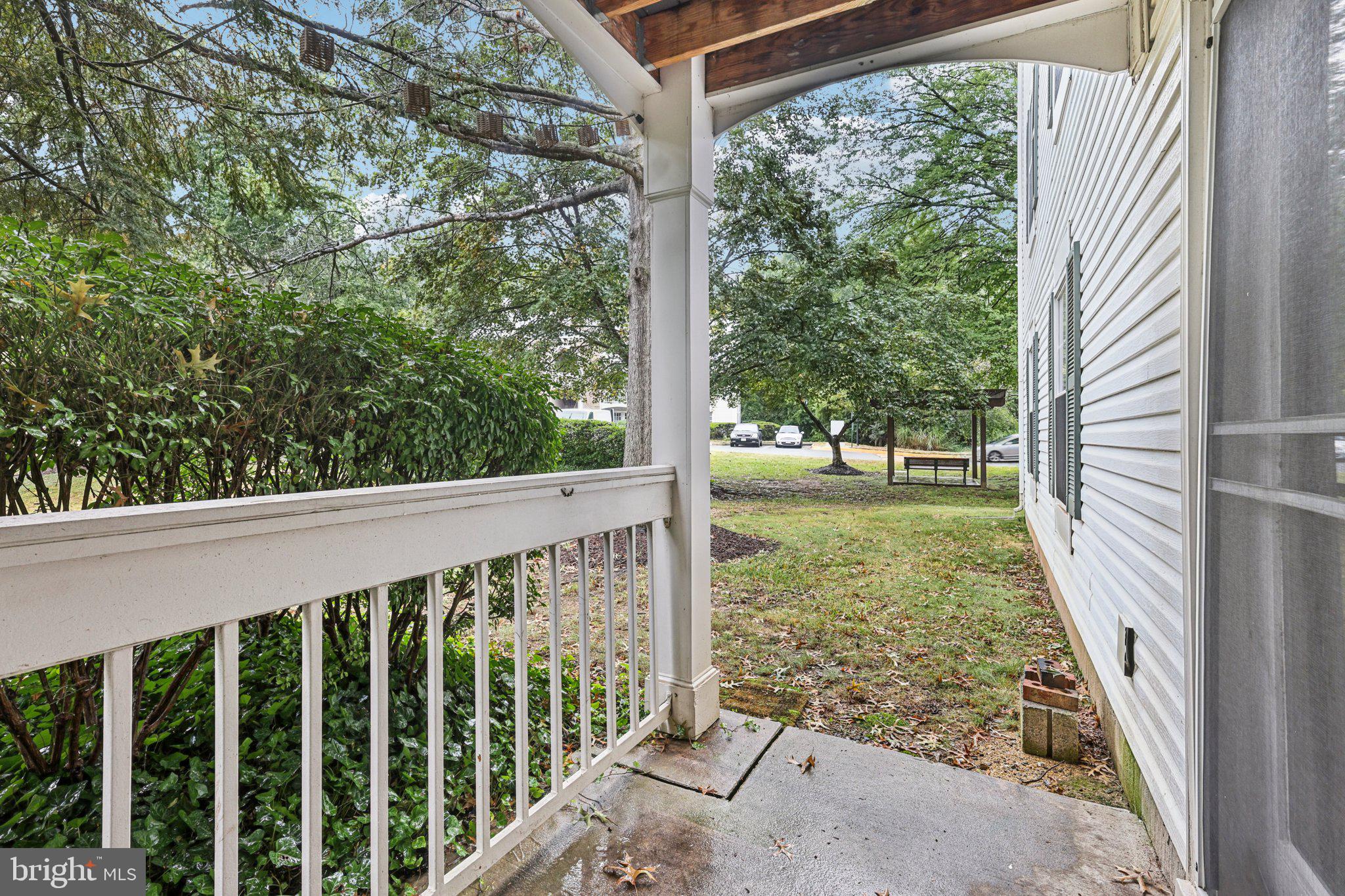 5707 Olde Mill Court, Unit 111 Alexandria, VA 22309 - Photo 26 of 32 a view of porch with a small yard