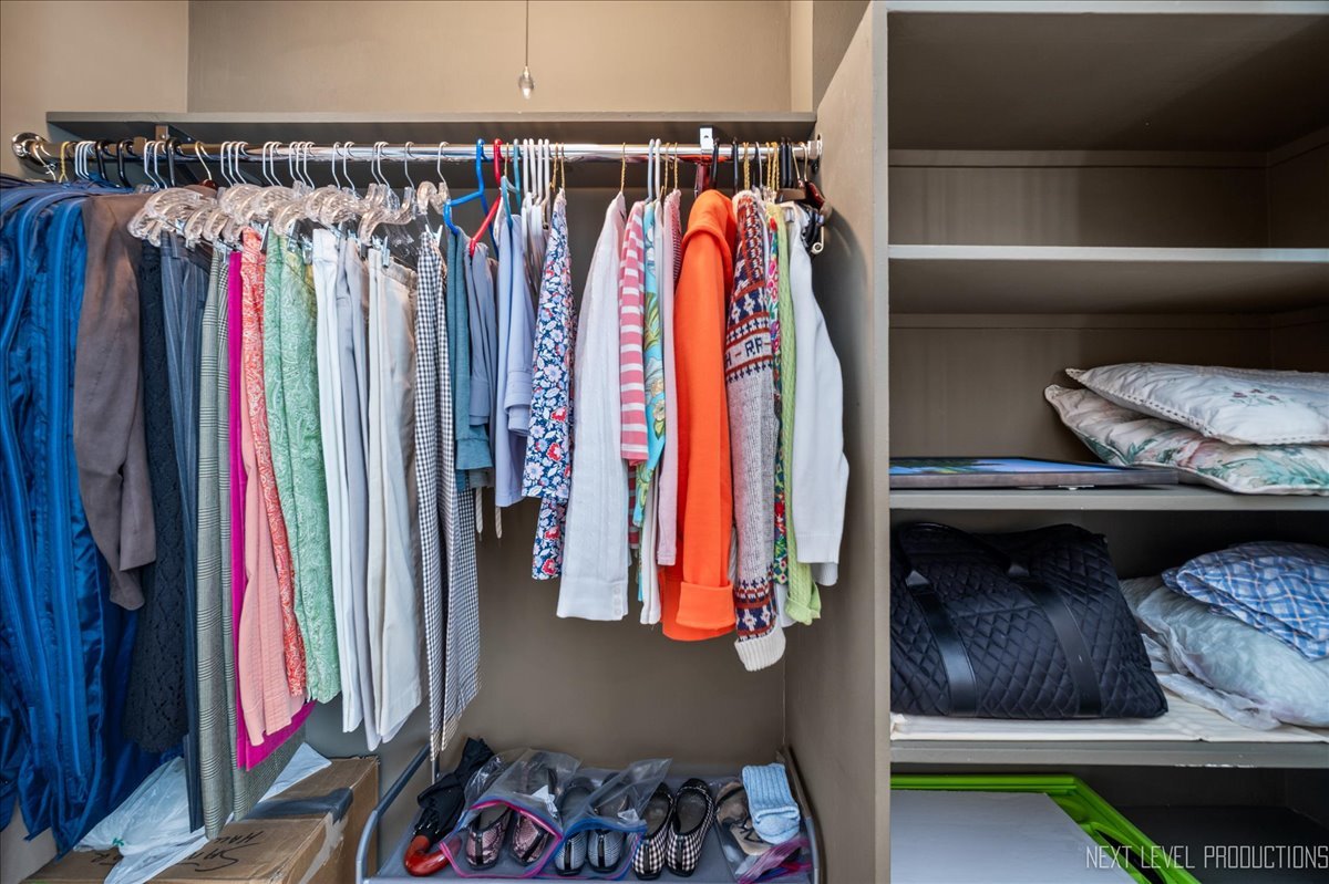3180 North Lake Shore Drive, Unit 5E Chicago, IL 60657 - Photo 23 of 28 a view of walk in closet with clothes and shoes