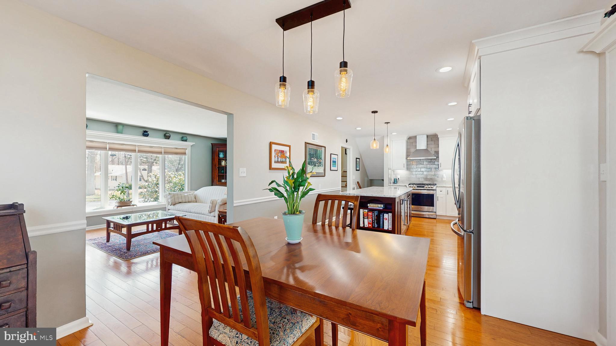 27 Farm Road Ewing, NJ 08638 - Photo 13 of 47 a large living room with kitchen view and a dining table