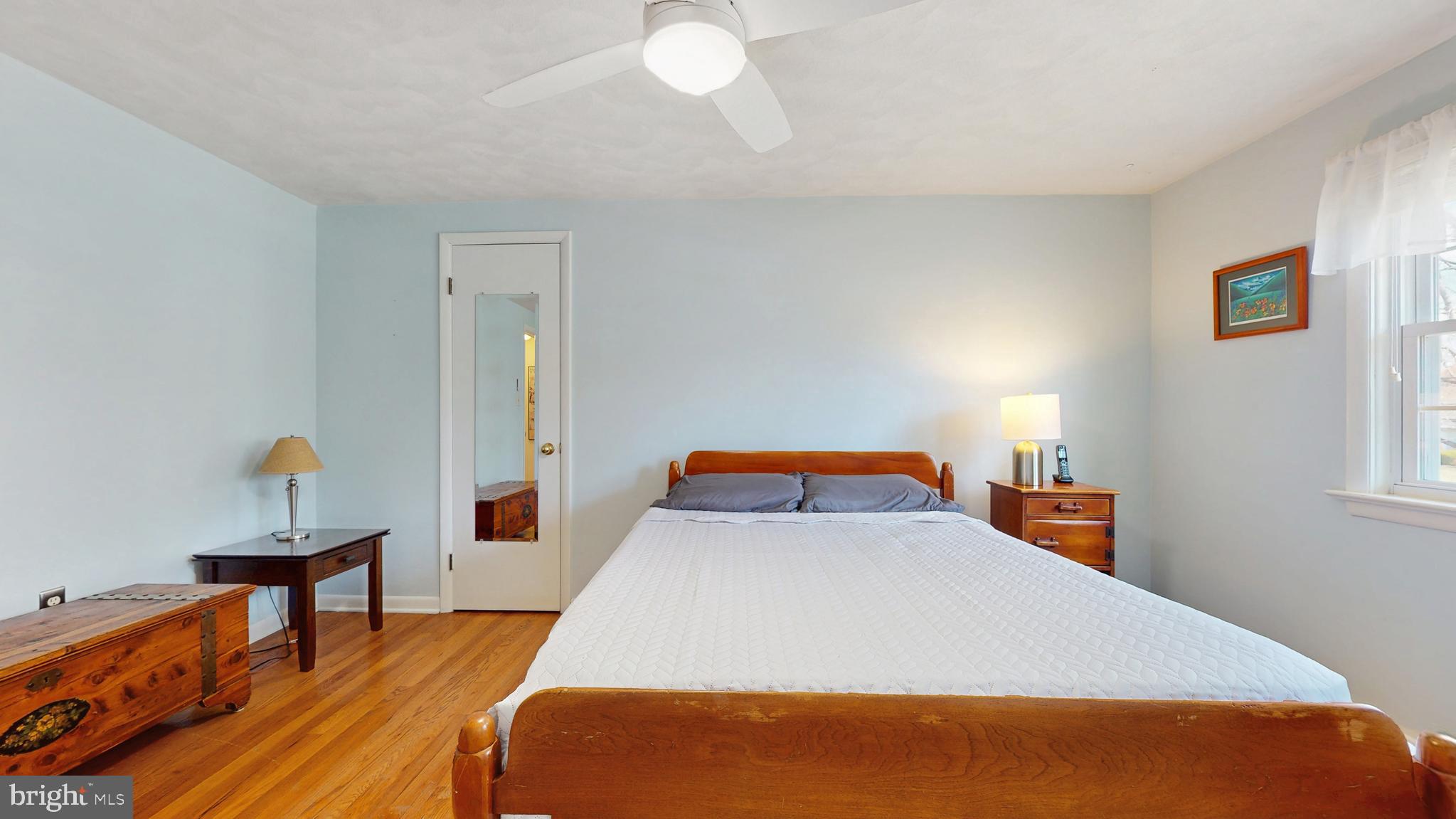 27 Farm Road Ewing, NJ 08638 - Photo 22 of 47 a bedroom with a bed and wooden floor