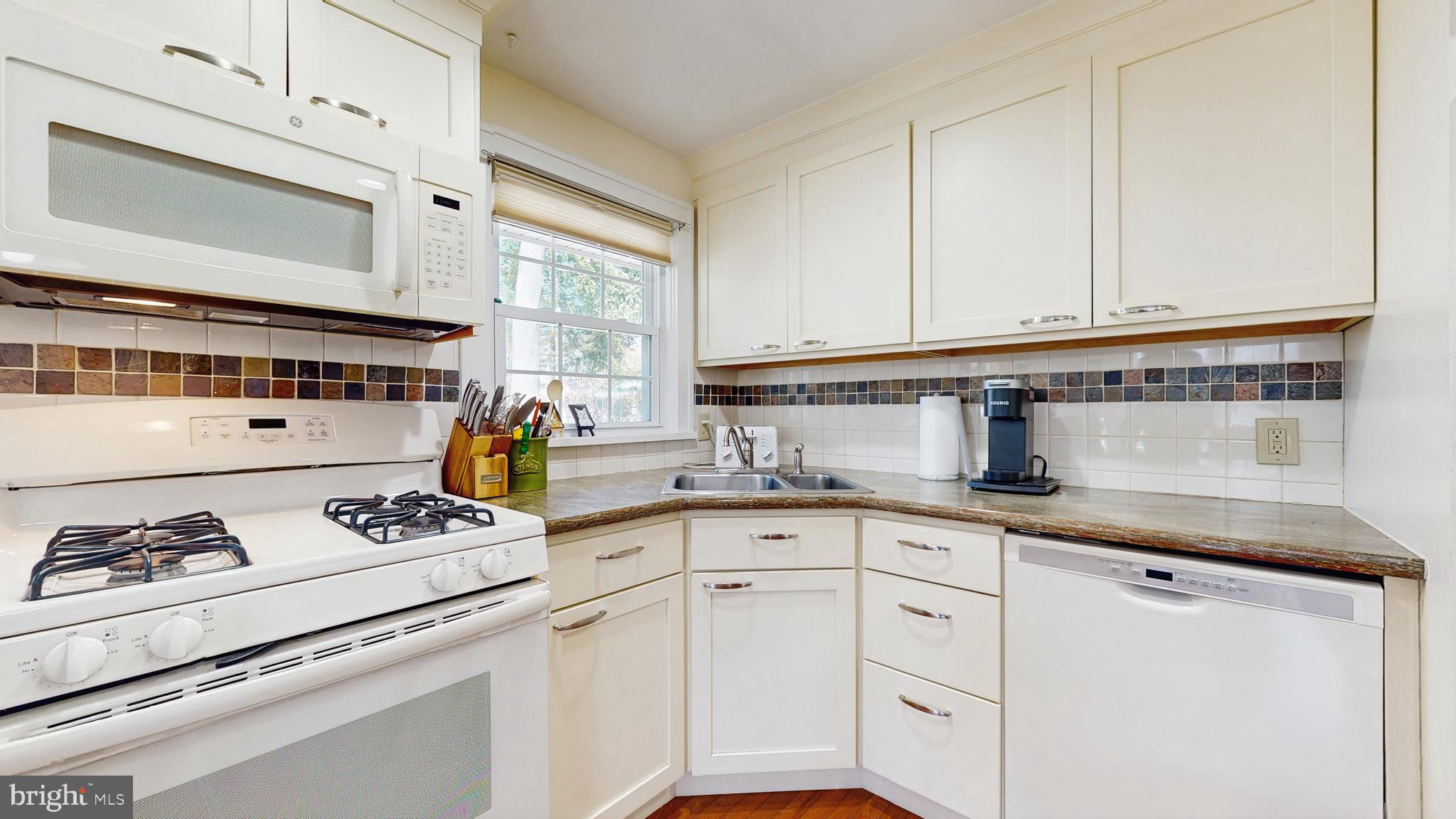 27 Farm Road Ewing, NJ 08638 - Photo 29 of 47 a kitchen with granite countertop white cabinets and white appliances