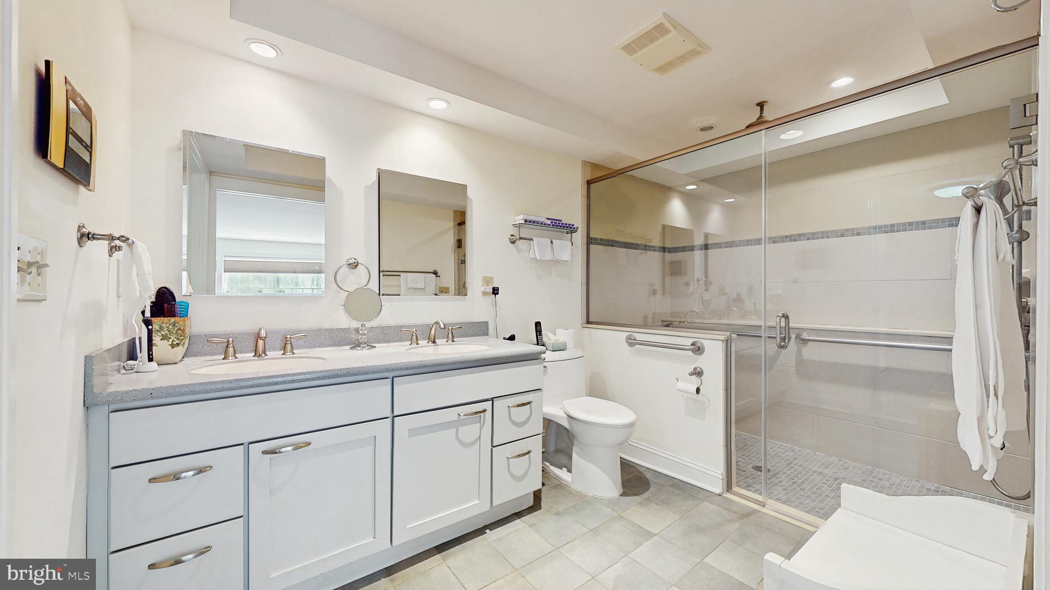 27 Farm Road Ewing, NJ 08638 - Photo 32 of 47 a bathroom with a toilet a sink a mirror and a shower