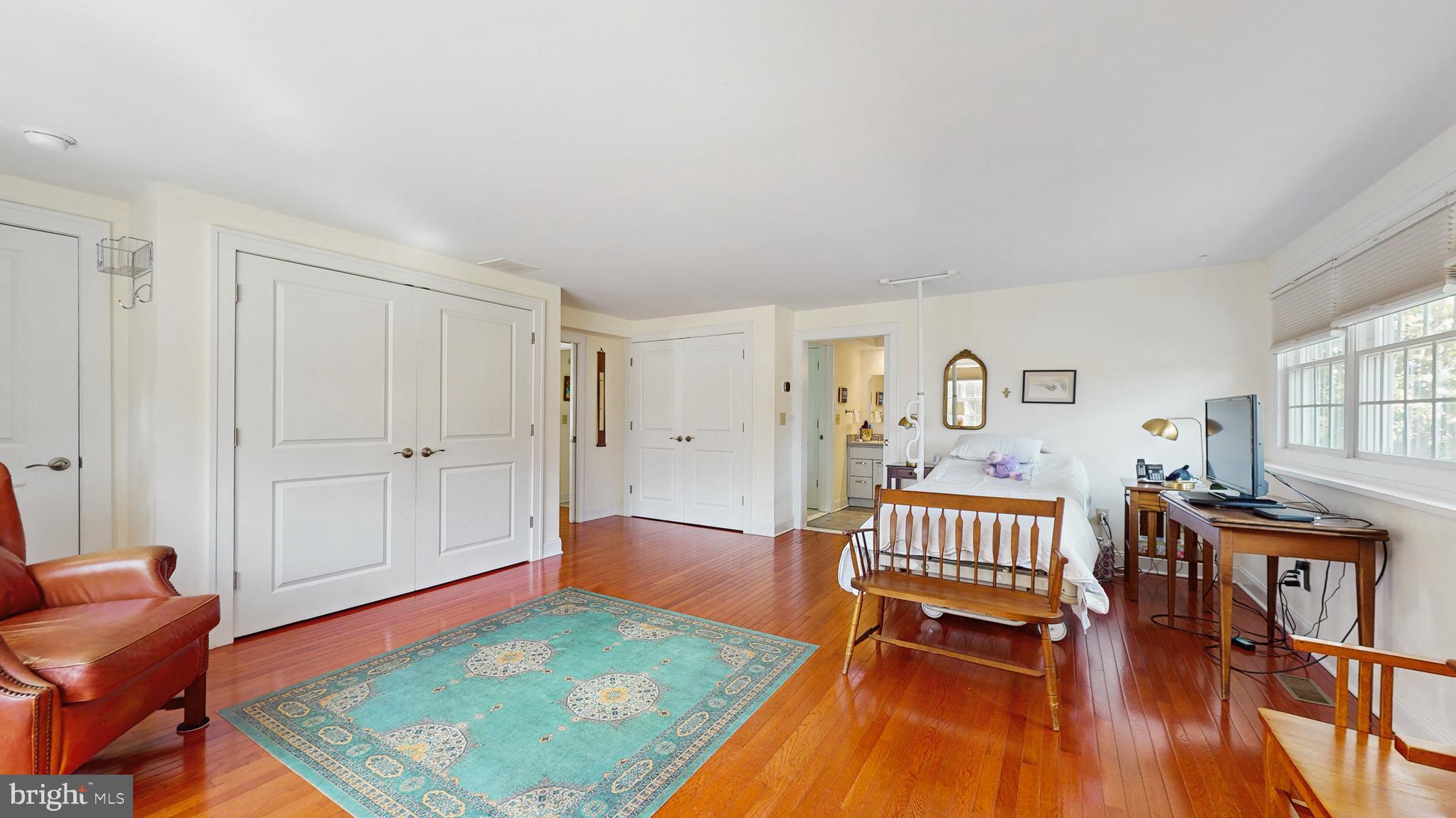 27 Farm Road Ewing, NJ 08638 - Photo 33 of 47 a bedroom with furniture and a wooden floor