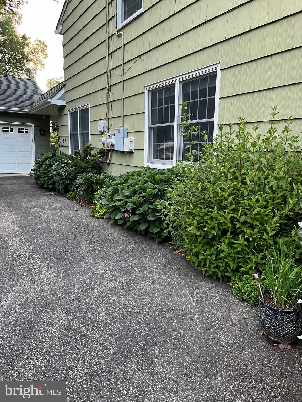 27 Farm Road Ewing, NJ 08638 - Photo 34 of 47 a view of a house with potted plants