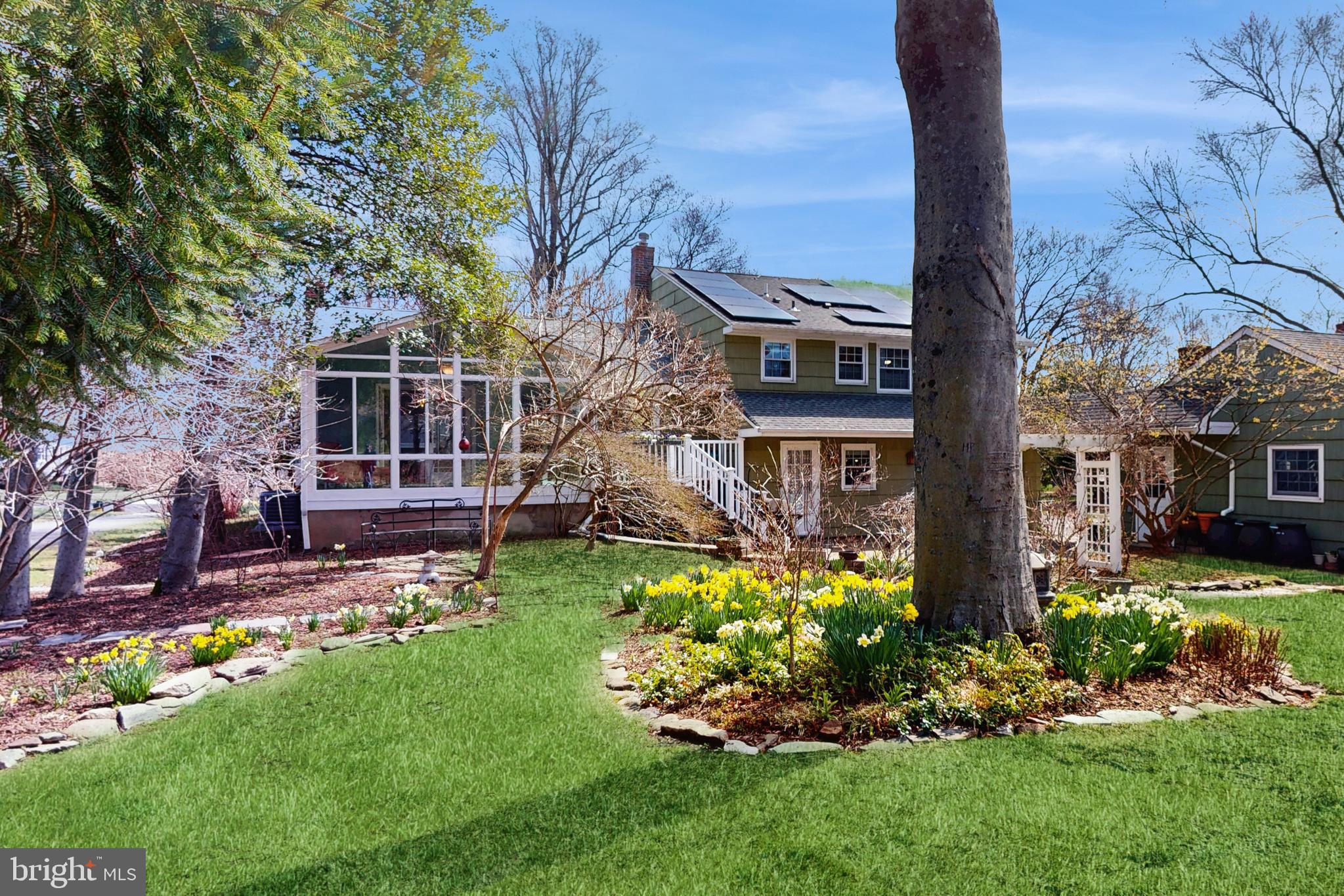 27 Farm Road Ewing, NJ 08638 - Photo 40 of 47 a front view of a house with a garden and plants