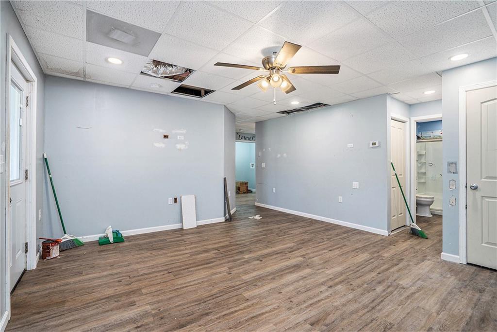 115 Floating Leaf Way Dallas, GA 30132 - Photo 32 of 47 wooden floor in an empty room with a window