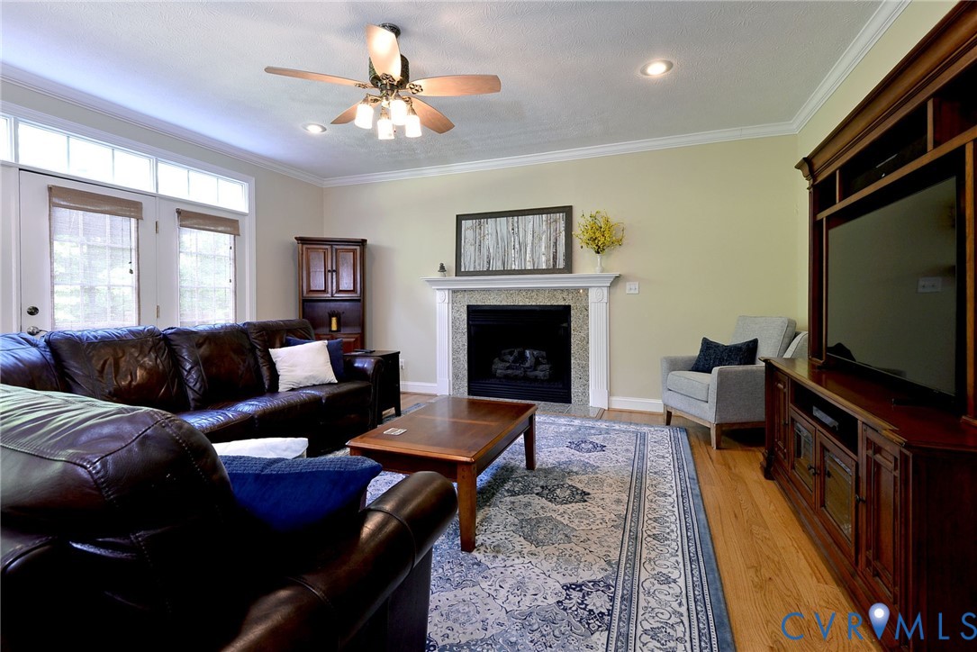4015 Cold Spring Road Williamsburg, VA 23188 - Photo 9 of 57 Living area featuring a fireplace with a stone sur