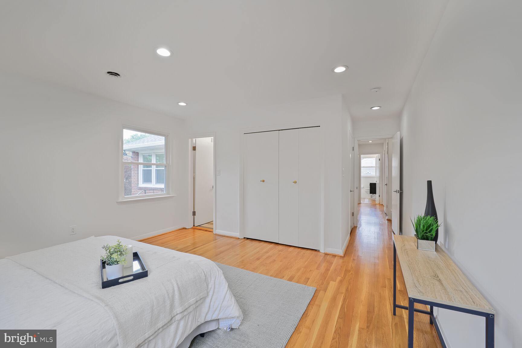 4609 22nd Avenue Mount Rainier, MD 20712 - Photo 12 of 33 a bedroom with a bed and wooden floor