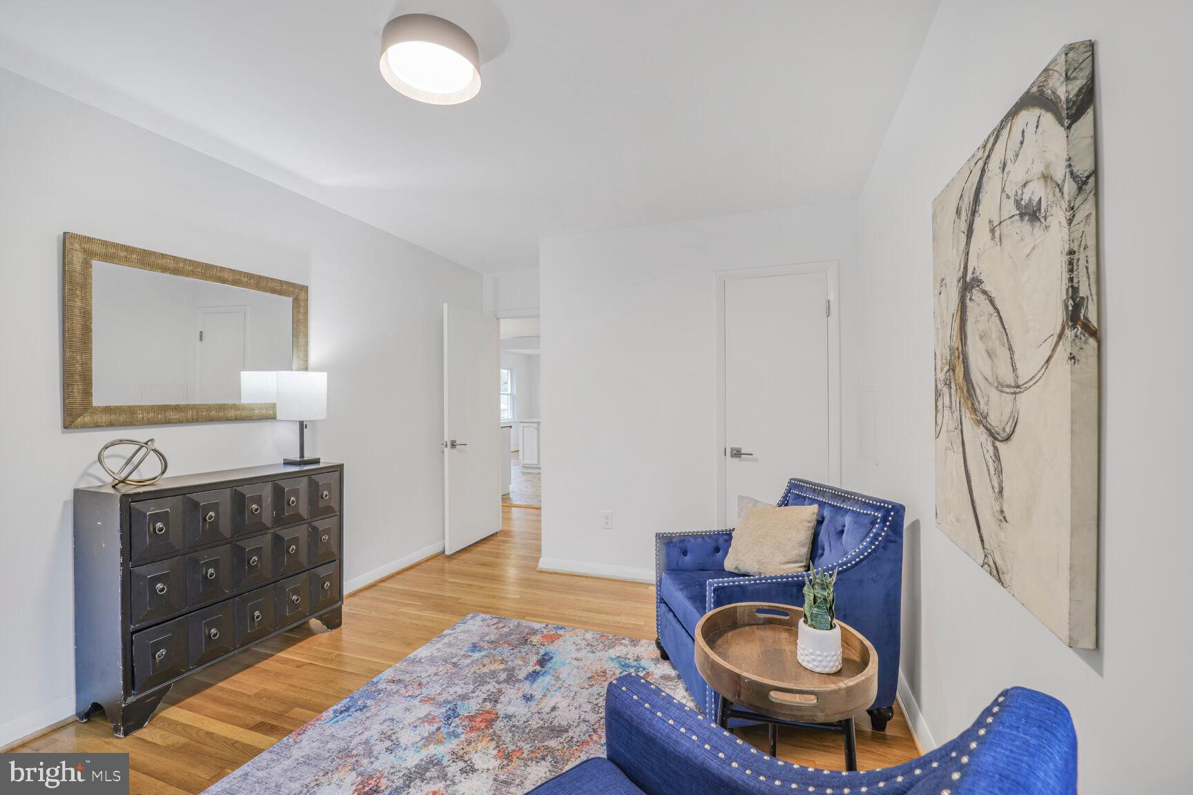 4609 22nd Avenue Mount Rainier, MD 20712 - Photo 16 of 33 a living room with furniture a rug and a fireplace